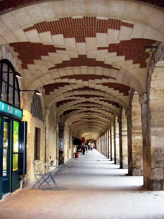 Arcades in le Marais' Place des Vosges