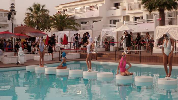 Women displayed in an Ibiza pool