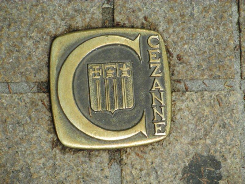 Bronze plaque in pavement for following Cezanne trail