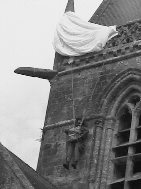 St Mere Eglise parachutist caught on church roof