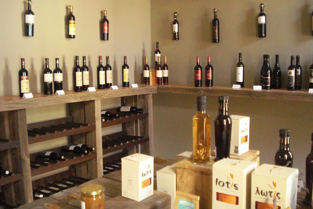 Greek wine store with shelves and tables full of Greek wine bottles