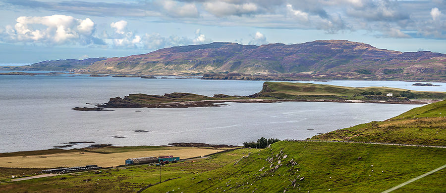 The Isle of Inchkenneth with Ulva behind painted purple by the heather. Taken from high in Ardmeanagh, Mull. 