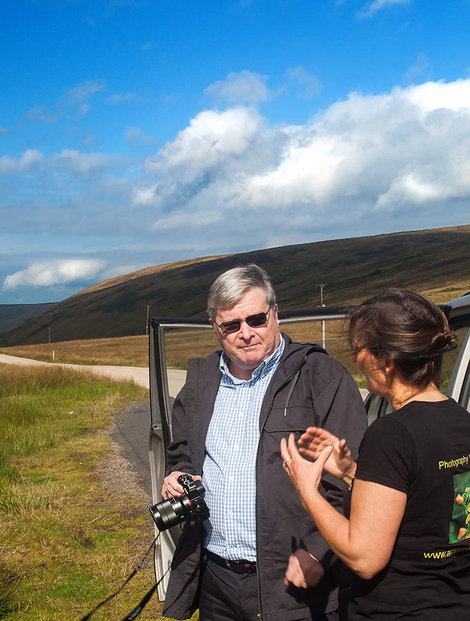 Jackie Newman of Arran in Focus showing my husband James one of the finer points of photography.