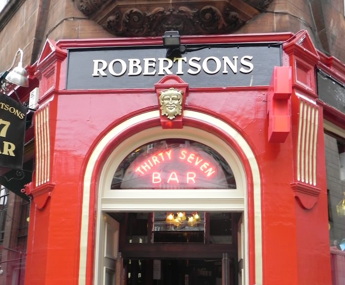 The Green Man face over the entrance to Robertsons