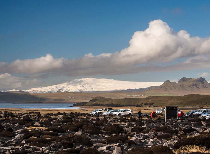 The icecap of Myrdalsjökull, Iceland’s fourth largest glacier, as seen from the shore near Vik. Katla, an active volcano rumbles continuously beneath the ice. Several glacial snouts radiate from the main glacier. 