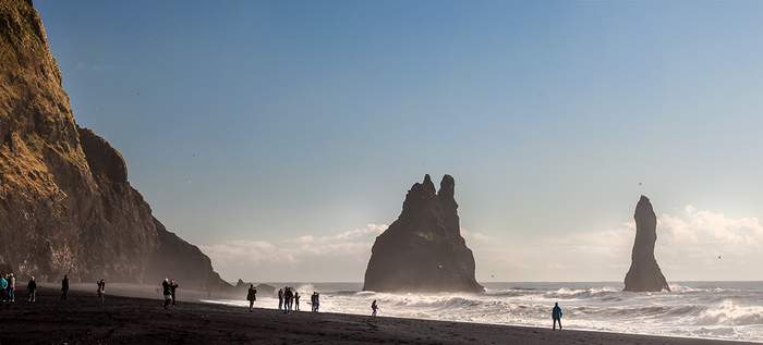The black sand beach and rock formations at Reynisfjara are the most popular and photogenic stops on the South Shore tour.