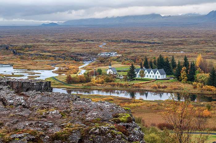 The wide and flat rift valley at Pingvellir, north of the lake, is riven by deep fissures running north-south. The first church was consecrated here in 1000CE and the present church was built in 1859.