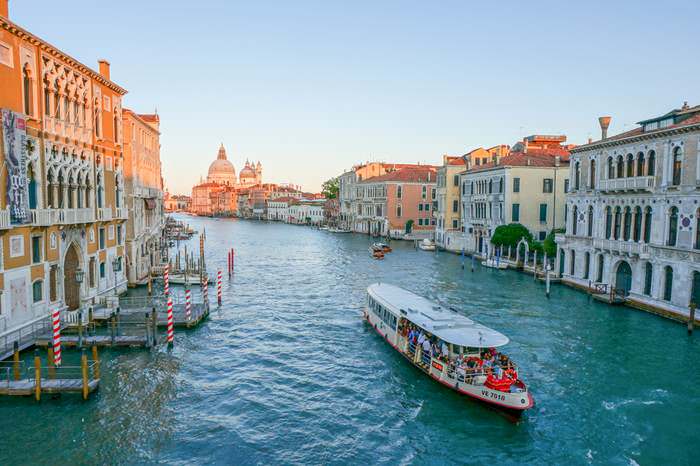 Vaporetto travels along the Grand Canal at sunset n Venice