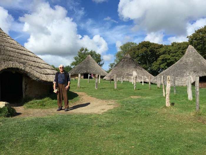 Thatch-roofed houses at Castell Henlyss, a replica of an Iron Age village in Wales