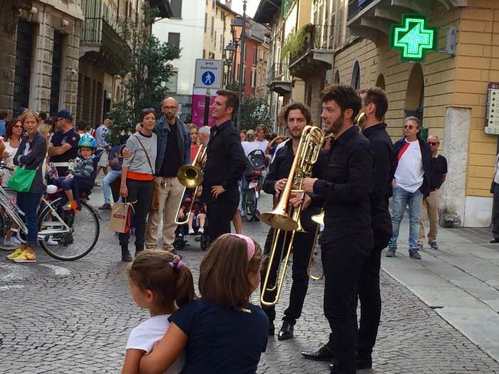 An impromptu brass band in a city piazza, part of the Brescia Opera Festival