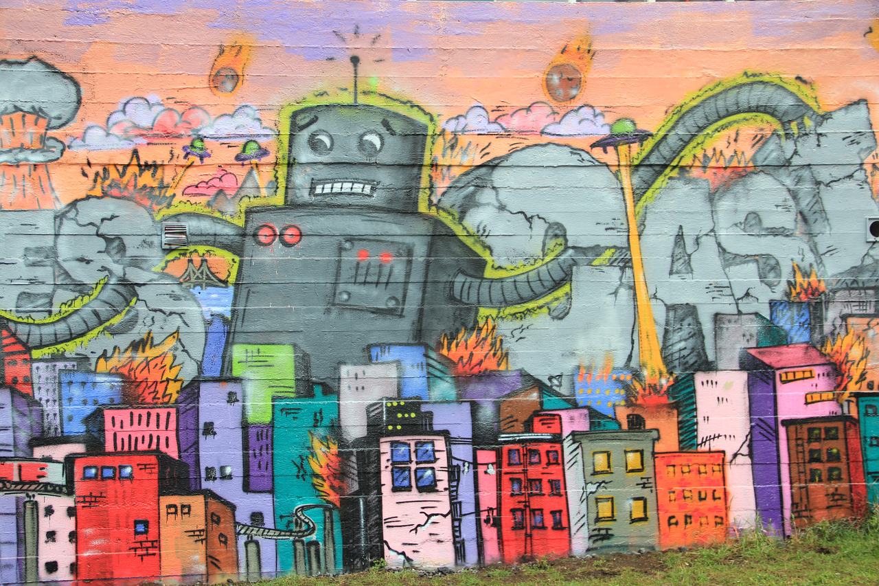 Street art in Iceland showing giant robots and small colorful houses