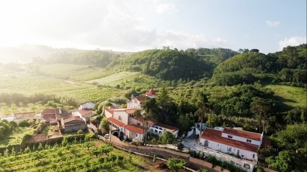 View over Buddha Retreat in Portugal in lush green hills