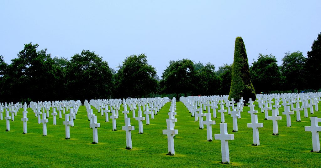 Rows of white crosses of fallen soldiers at the American Cemetery