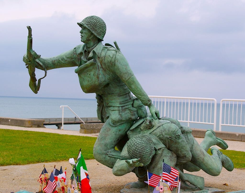 Omaha Beach Statue - Brass Running soldier carrying an injured soldier and a rifle 