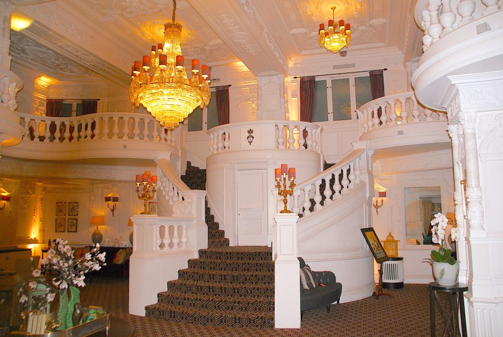 St. Ermin's front lobby, beautiful double staircase with a chandelier overhead