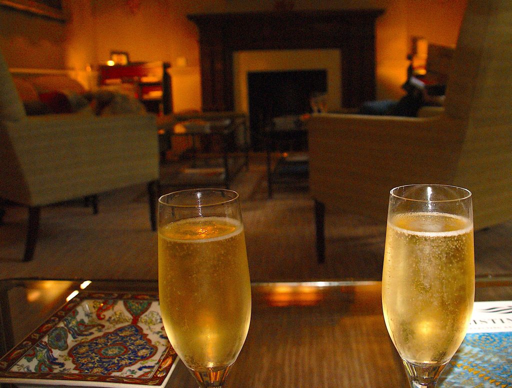 Champagne at the Draycott near the unlit fireplace