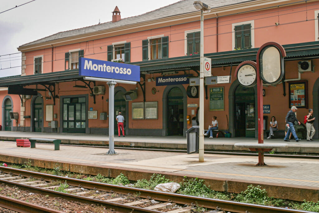 Train station at Monterosso Al Mare - pink building and train tracks