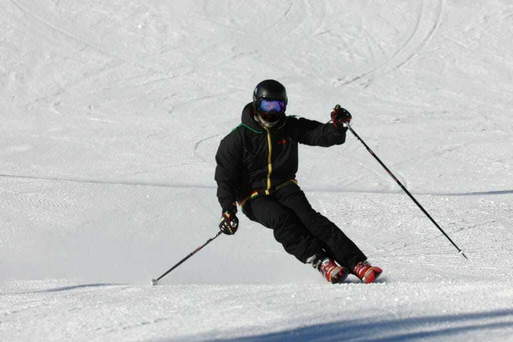 Skier swooshing down the ski run skillfully