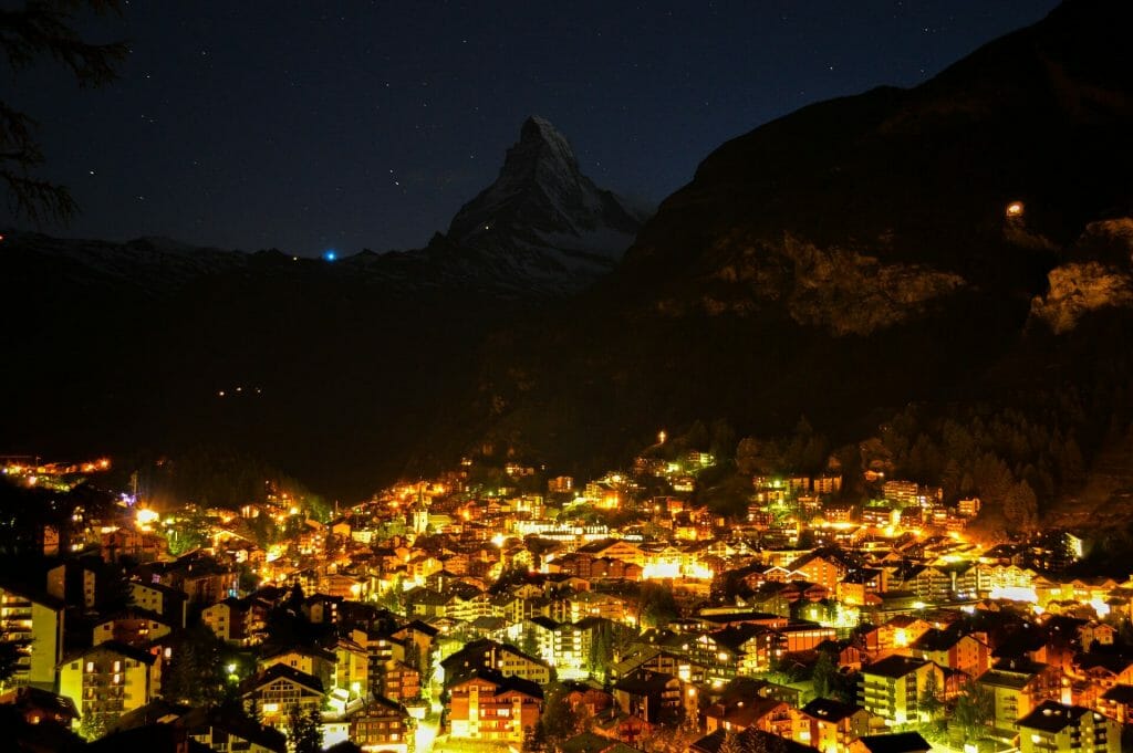 Twinkling Italian city on the Swiss thrumming with life