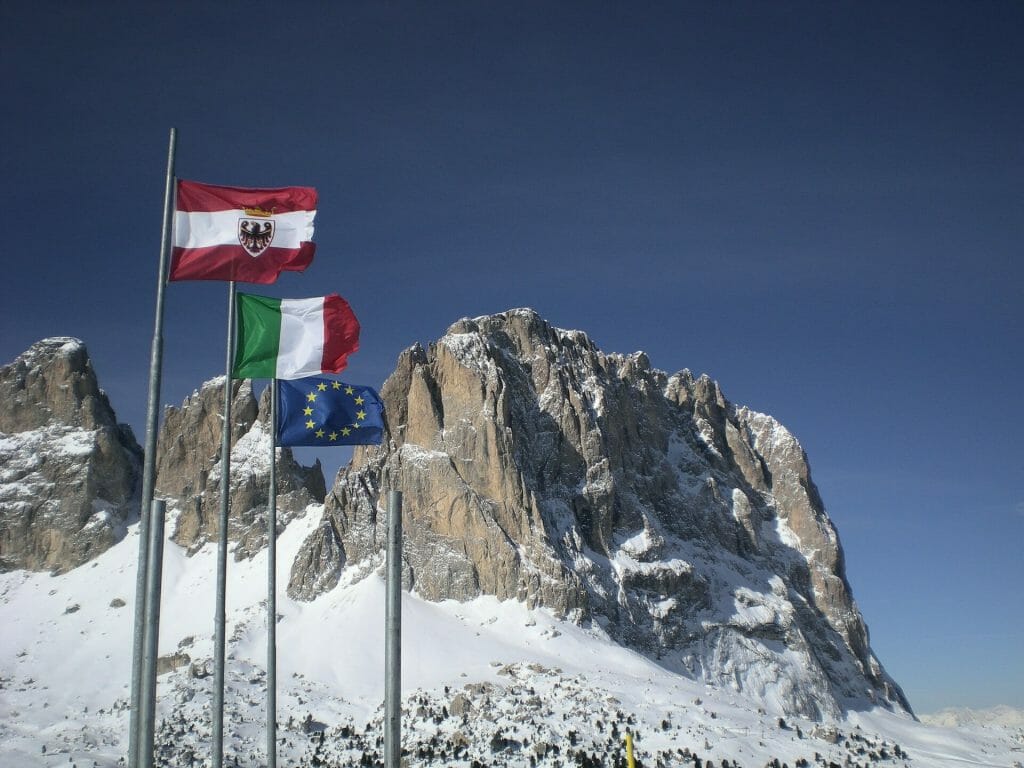 Flags of the Dolomites waving gracefully in the Dolomite peaks