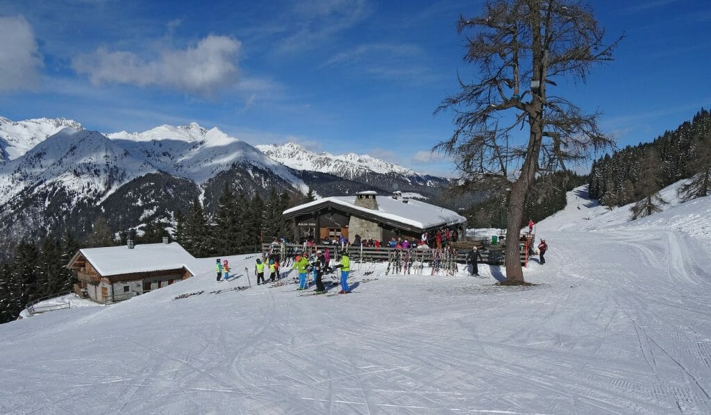 Ski resort with people lingering around in the beautiful winter
