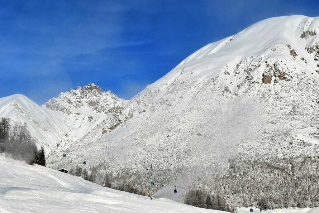 Freshly fallen snow on a crisp Italian mountain plain