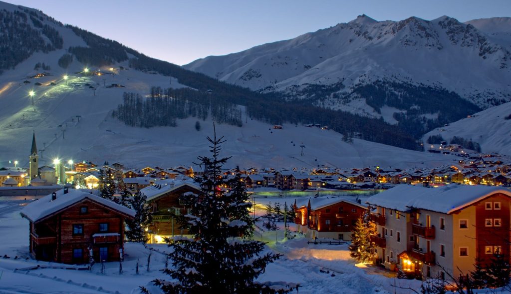 Twinklihng evening lights all around Livigno with the town humming with life