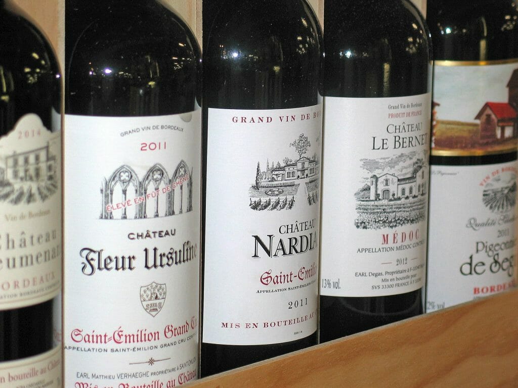 Bottles of french wine lined up on a table