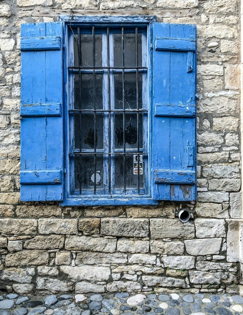 Old Window with blue shutters