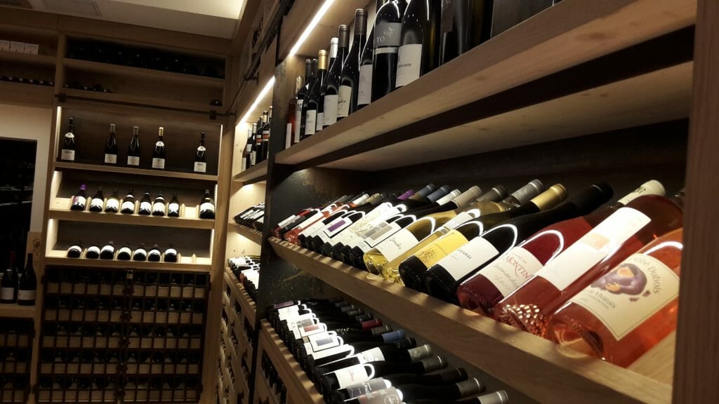Wine bottles on shelves at Carré du Palais in Avignon