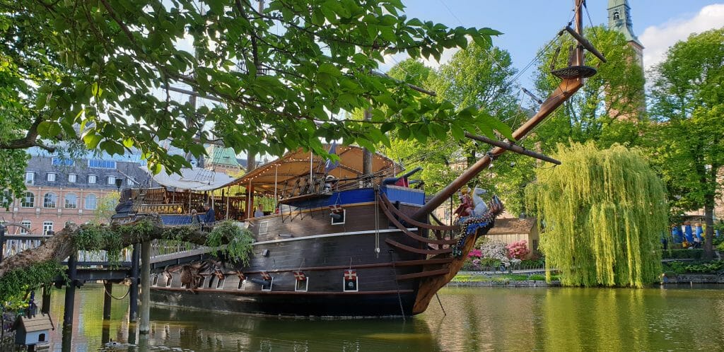 Wooden ship on canal in front of Tivoli Gardens in Copenhagen