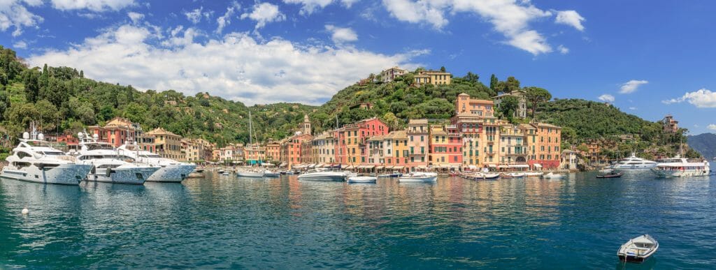 Popular Regions of Italy - Panoramic view on the harbour with yachts and boats and city of Portofino in Liguria Italy