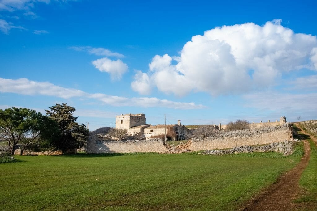Typical Murgia landscape with an old stone manor farm called masseria.