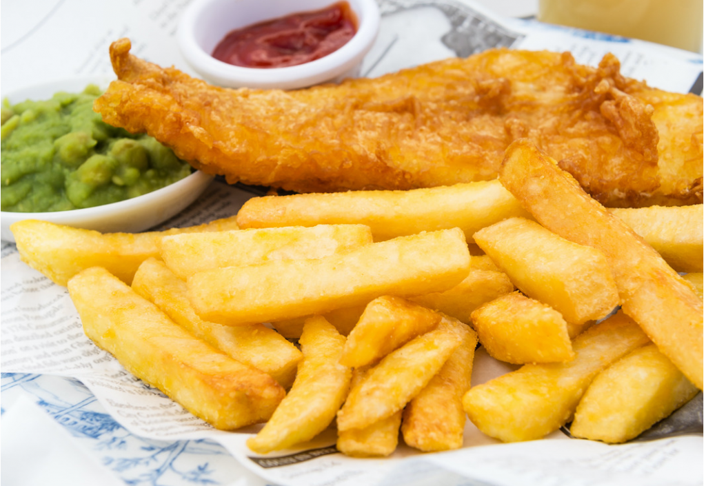 plate with Fish and Chips, a small bowl of mushy peas and ketchup