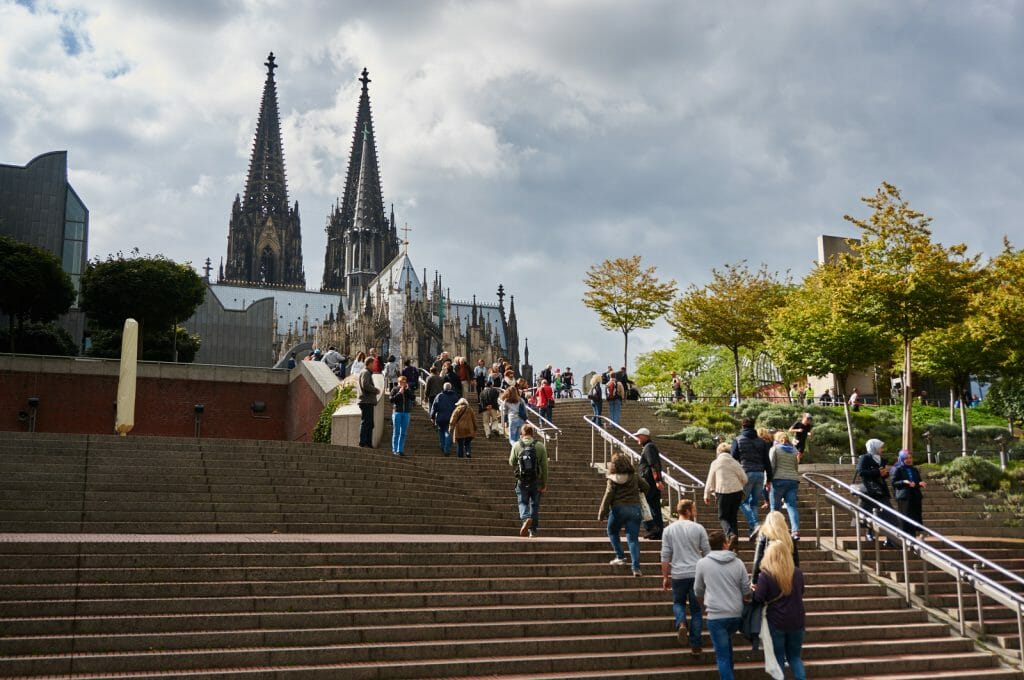 Cologne Cathedral Koelner Dom seen from Museum Ludwig square with large set of stairs in the foreground