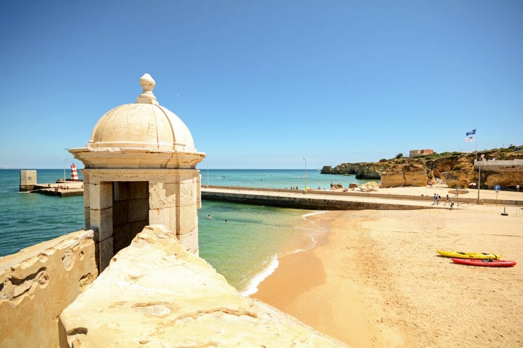 View from fortress Forte da Ponta da Bandeira in Lagos to waterfront with beach Praia da Batata, Algarve Portugal