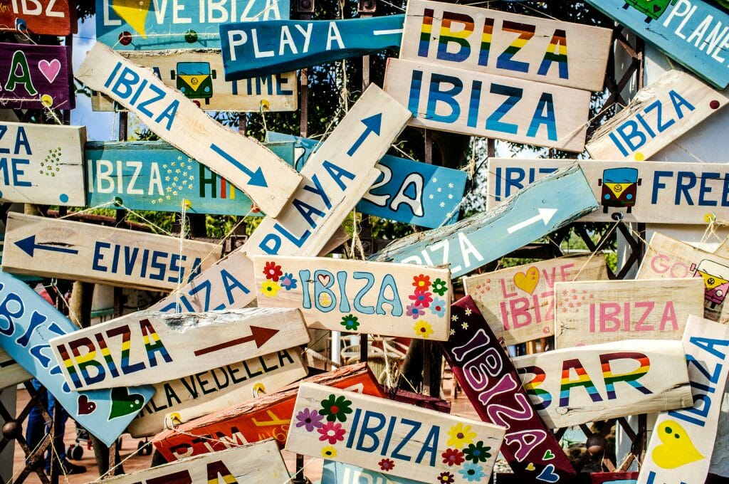 a pile of signs with Ibiza written on them