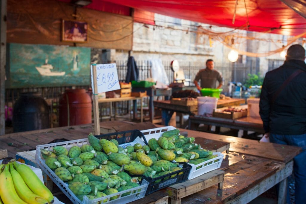 PALERMO, ITALY - DECEMBER 28, 2013: View of open air fruit market in Ballaro famous neighborhood in Palermo