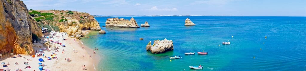 Panorama from the natural rocks and beaches at Lagos in the Algarve Portugal