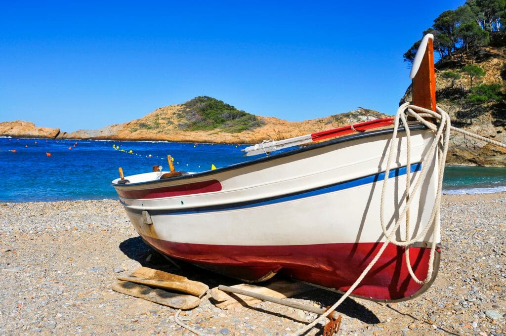 closeup of a fishing boat stranded on Sa Tuna beach in Begur, in the Costa Brava, Catalonia, Spain