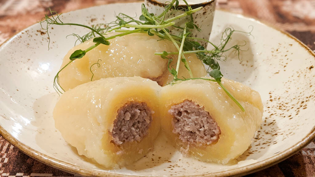 Cepelinai - Lituanian Potato Dumplings on a plate