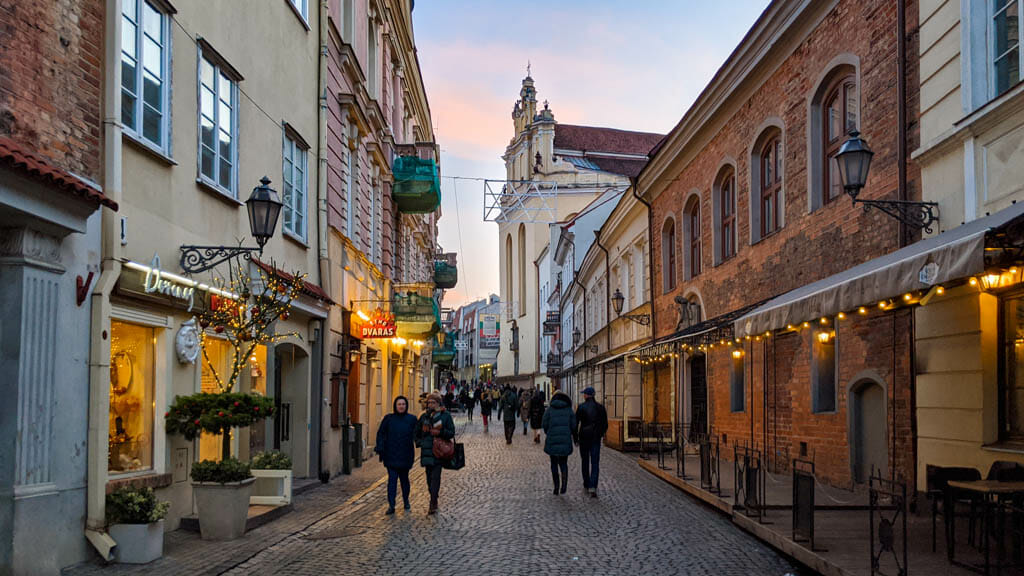 People walking on cobble stoned street in old town vilnius lithuania