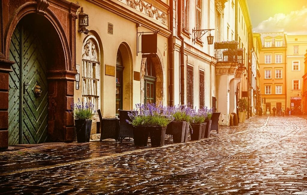 Historic Buildings on cobblestoned street in Old Town Krakow
