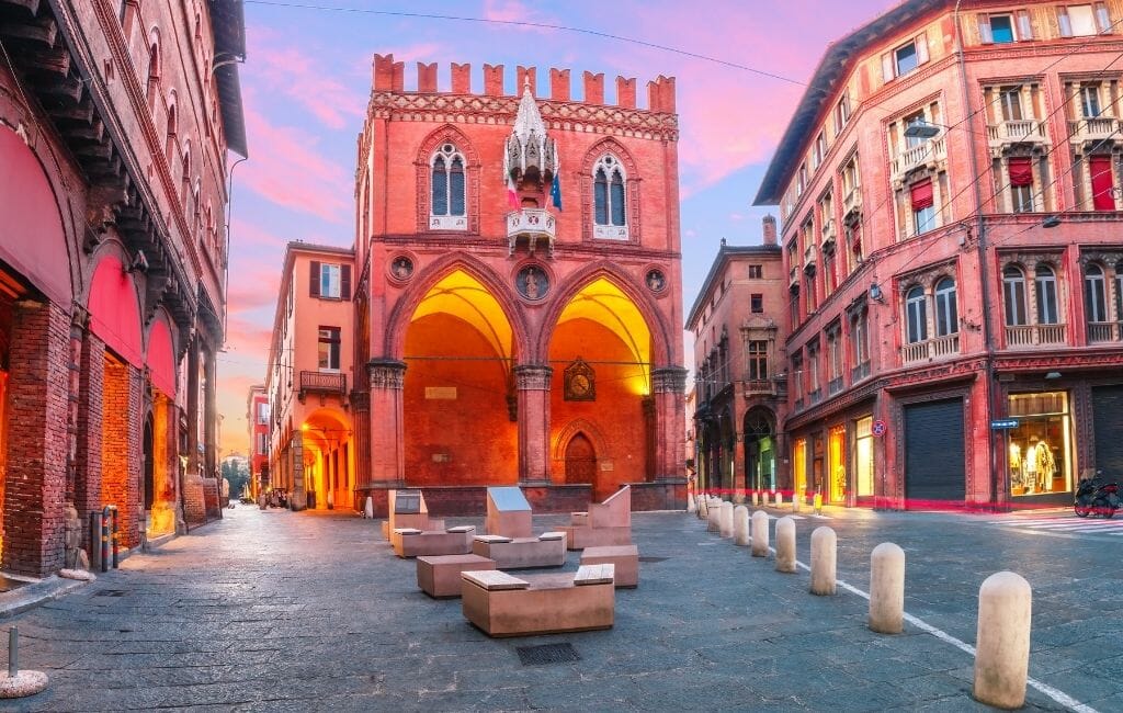 Pink historic Buildings in the center of Bologna Italy during a stunning sunset