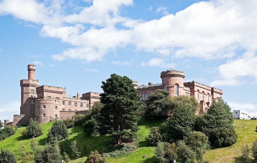 Inverness castle on top of a hill on a blue sky summer day
