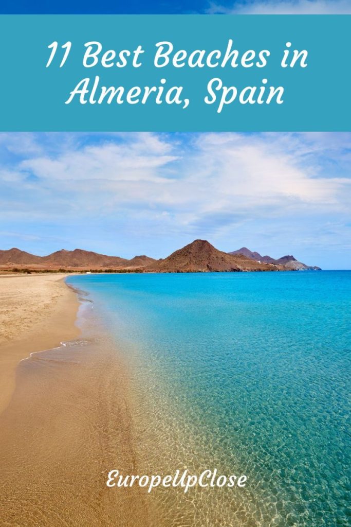 Almeria Spain is the perfect spot for a beachy vacation with lots of fun stuff to do. Read on for the best beaches in Almeria featuring fine sand and crystal clear water. Picture of sandy beach with turquoise water - text overlay with turquoise background: Best Beaches in Almeria Spain