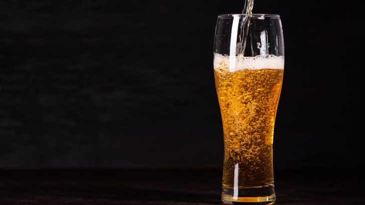 Black background, beer glass that is poured into from the top - Austrian Beer