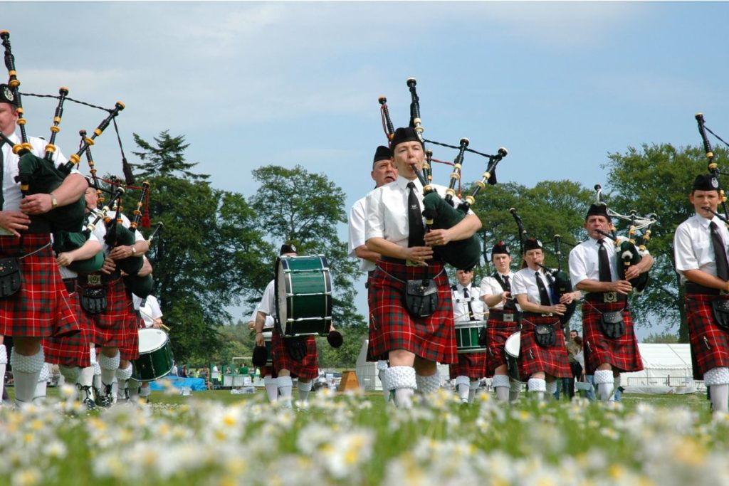 Group of Scottish Bagpipers with traditional tartans and dress 