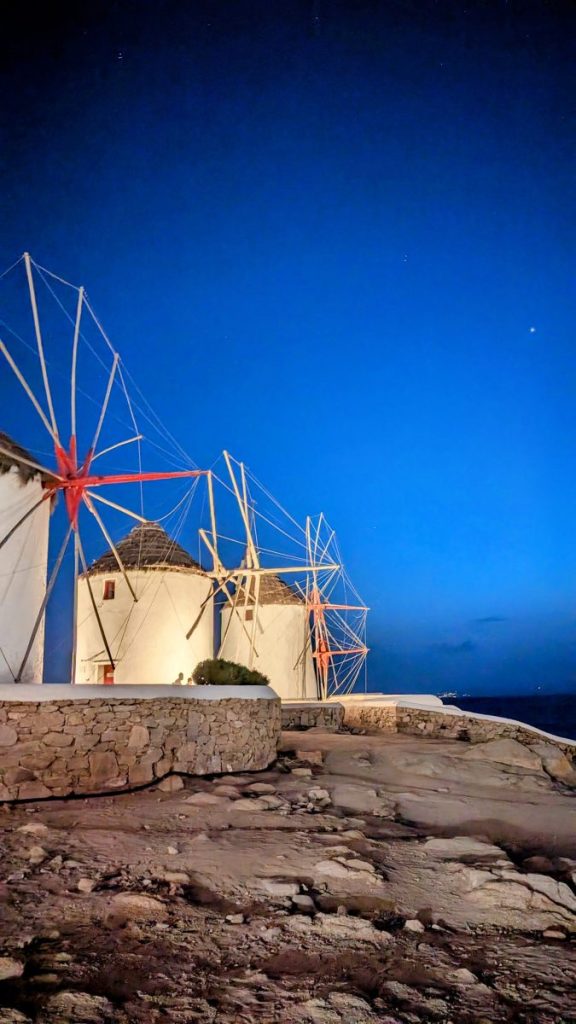 iconic windmills in Mykonos during blue hour