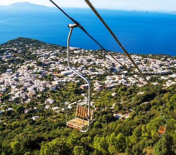 Chairlift overlooking Anacapri with the ocean in the back